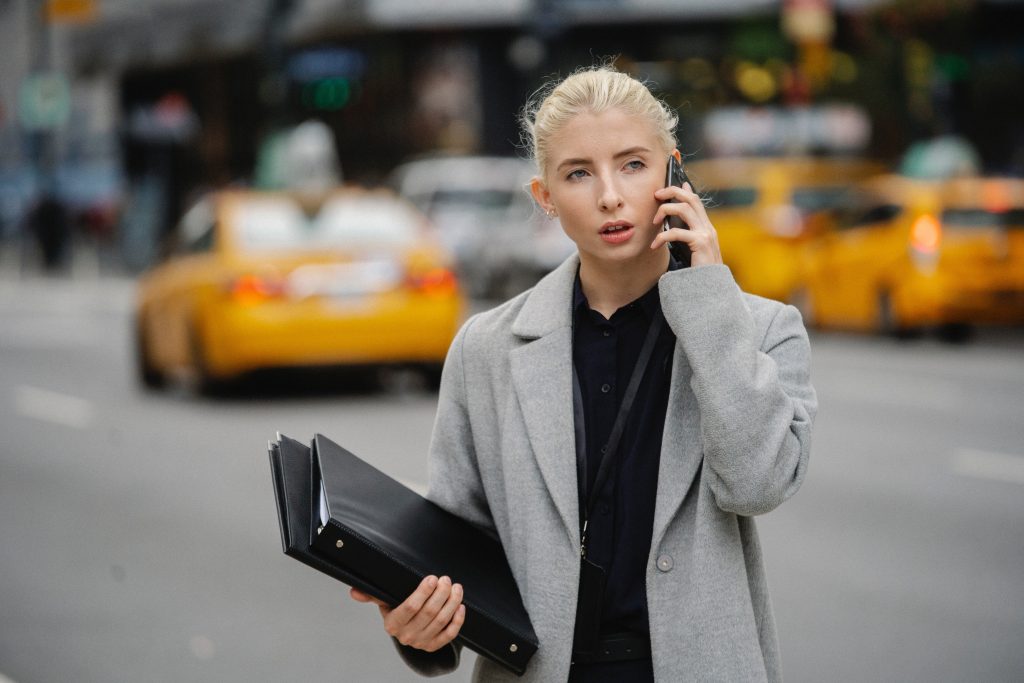 Business woman using an iPhone